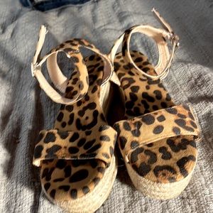 cheetah print wedged sandals, never been wore. they are in good condition.